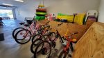 Garage stocked with 6 bikes, beach floats, and all kinds of beach toys